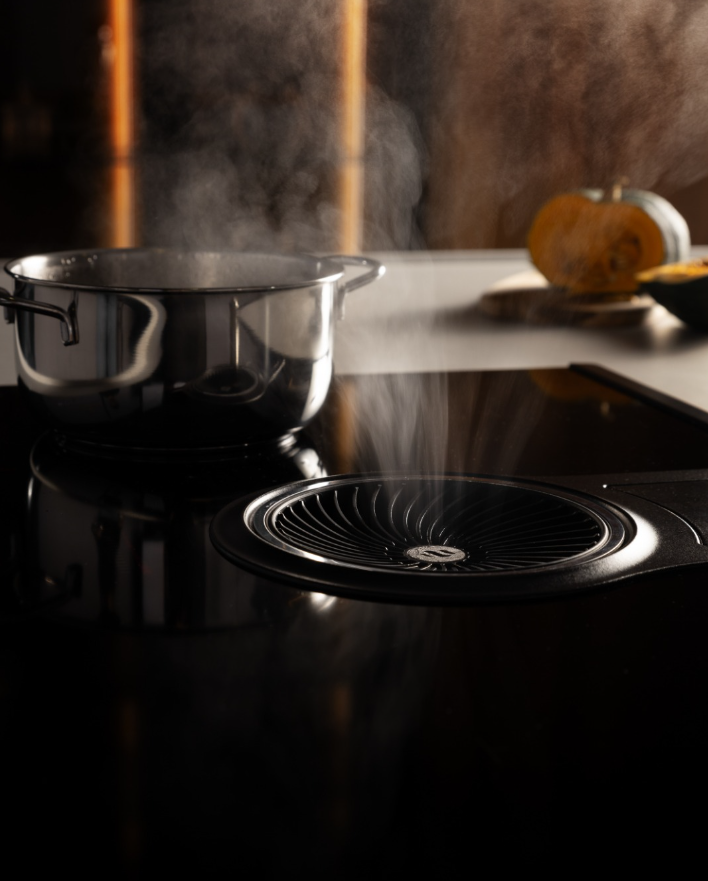 Integrated hood for induction hobs between design and functionality