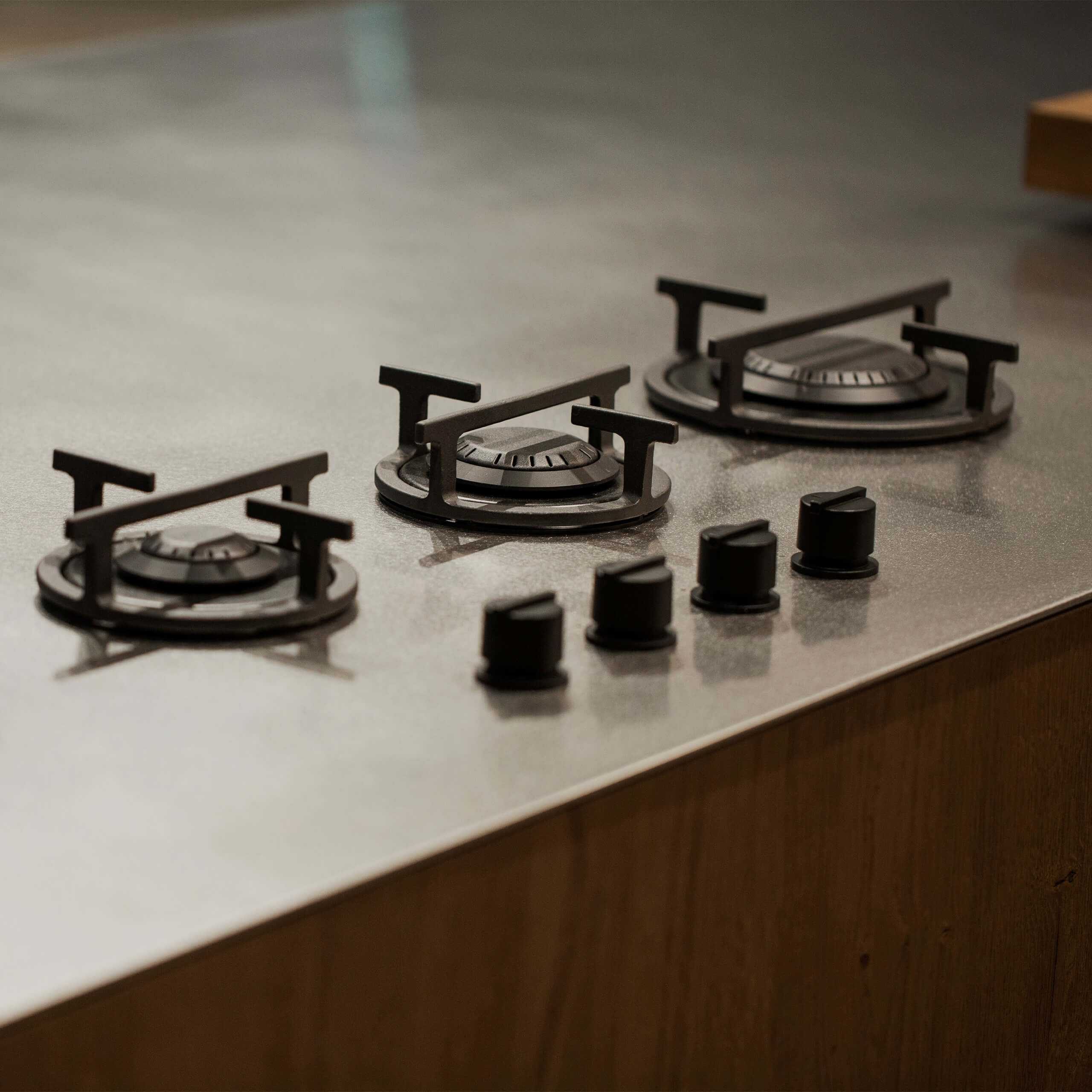 three burners on steel top